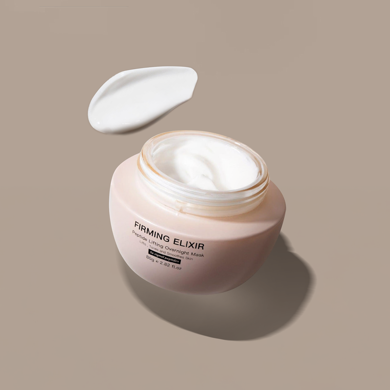 cream-texture-of-truffle-restorative-night-mask-with-smear-on-bakground
